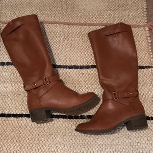 Light brown boots with buckle detail.